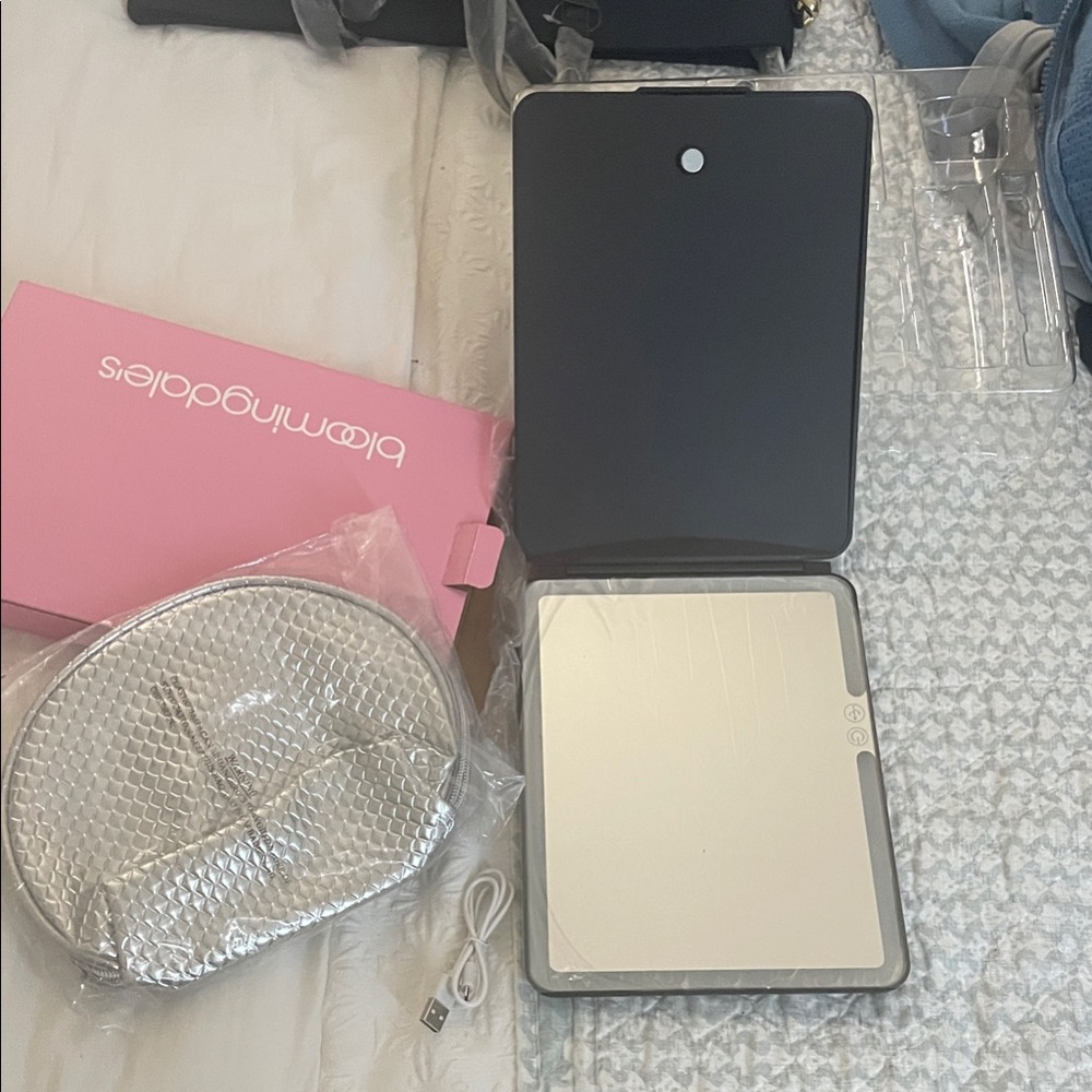 Bloomingdale's Black mirror and Silver make up Case.
Brand new.